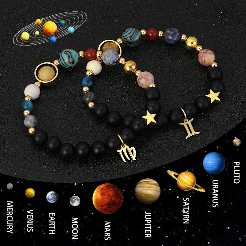 Bracelets with celestial-themed charms on a black background with solar system illustration
